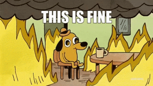 This is fine: a cartoon dog sits with a mug in a room engulfed in flames.